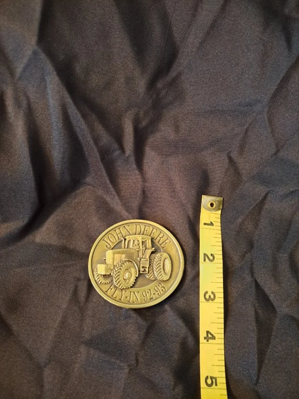 Vintage Bergamot Brass Works John Deere belt buckle with a 1992-93 Fly-In design
